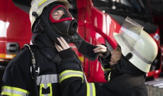 female-firefighter-adjusting-her-colleague-s-fire-mask (1)