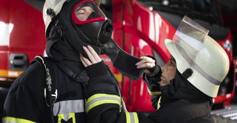 female-firefighter-adjusting-her-colleague-s-fire-mask (1)